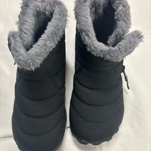 NEW   NEVER USED Black boots with grey  fur and zipper
